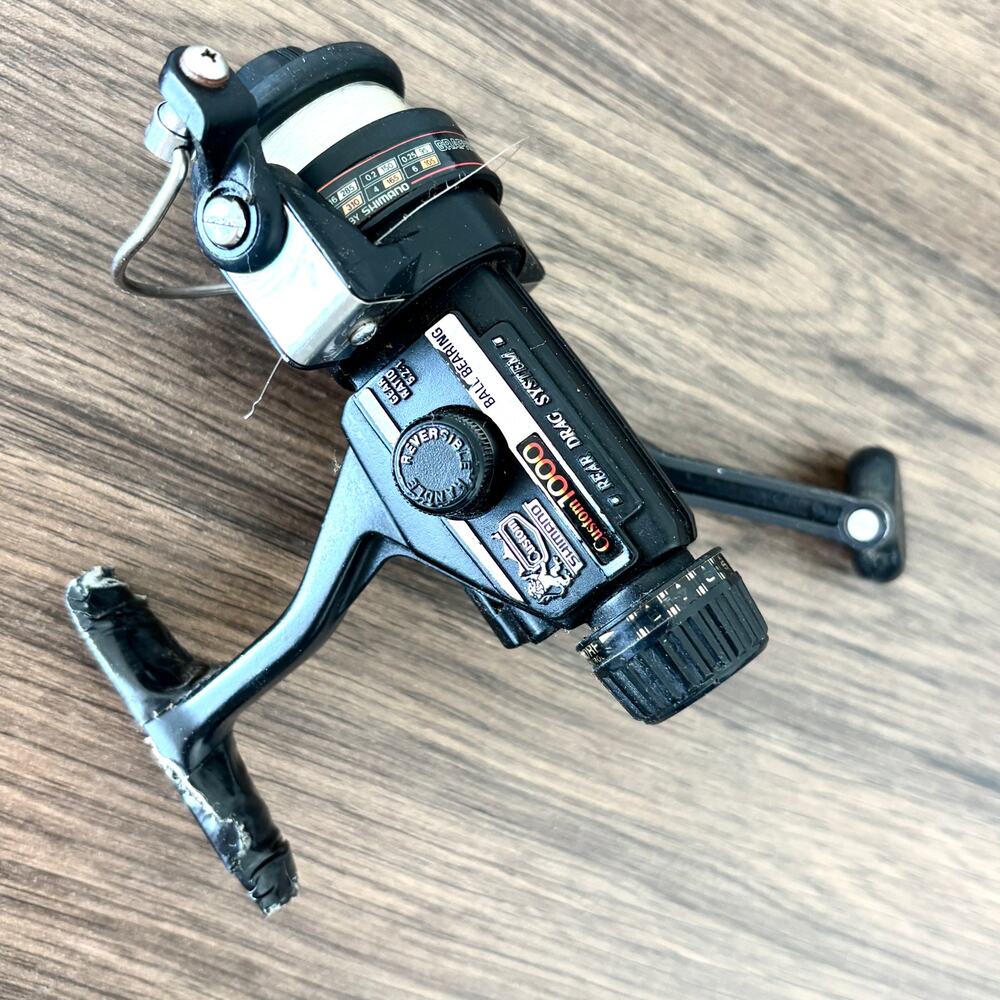 Vintage Shimano Custom 1000 Rear Drag Spinning Fishing Reel - Black
